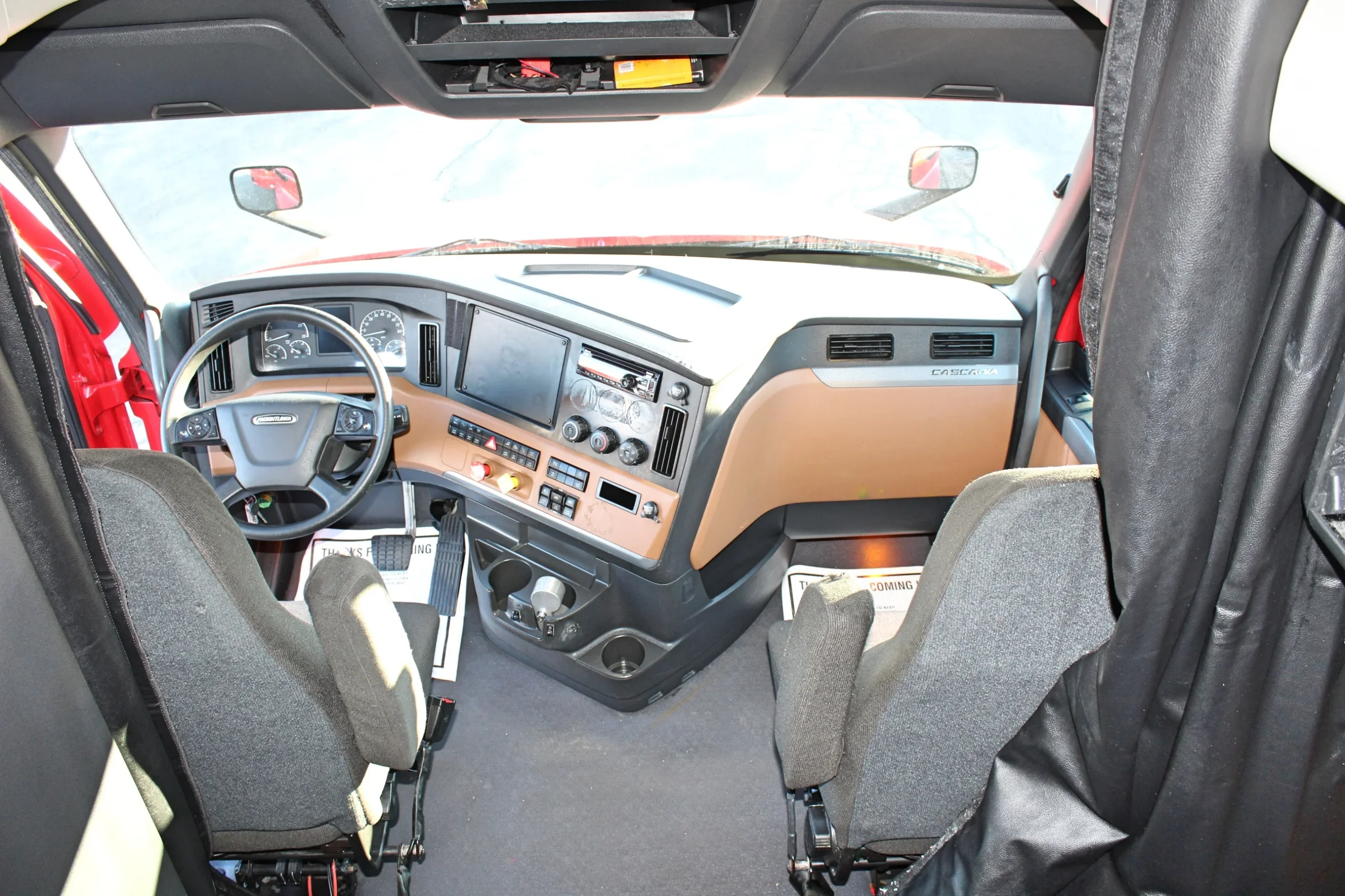 Truck sleeper cab interior with cozy bedding