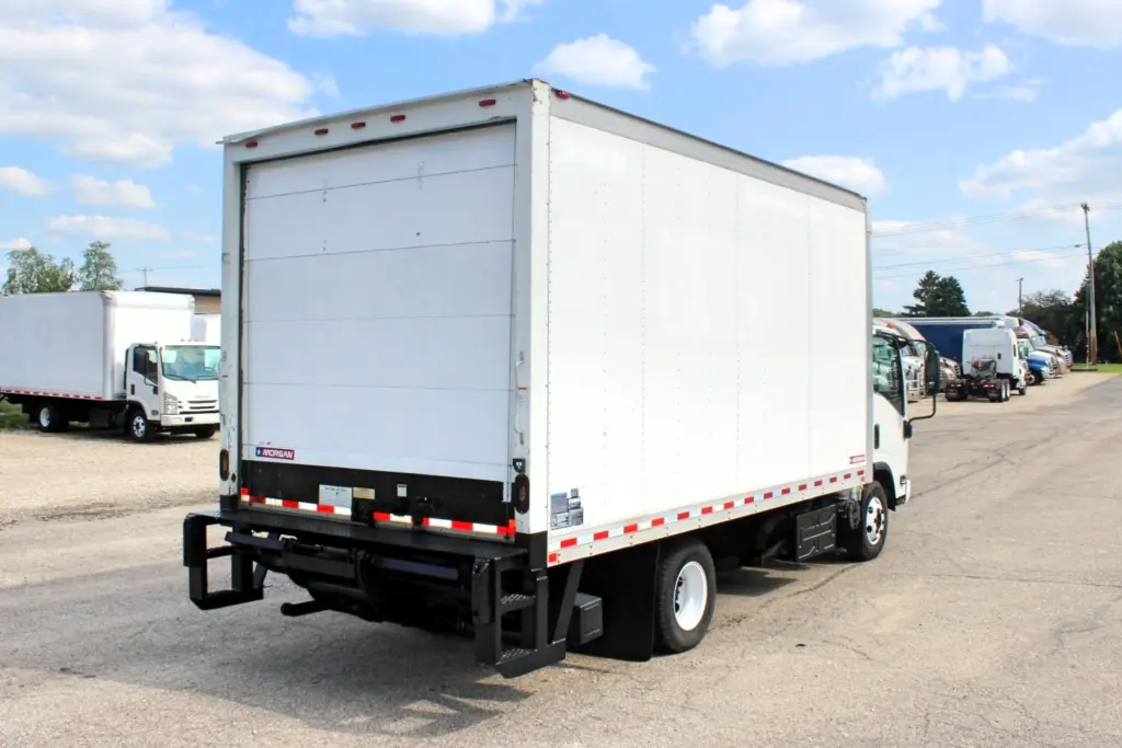 2019 Isuzu NPR HD white box truck rear passenger side view