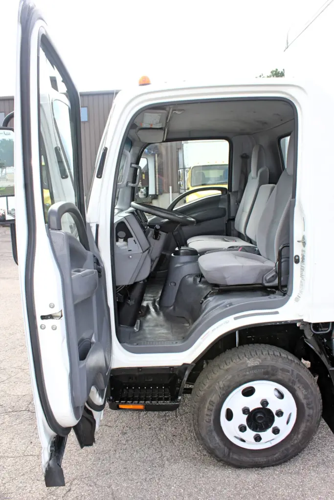 2019 Isuzu NPR HD driver door open showing cab interior