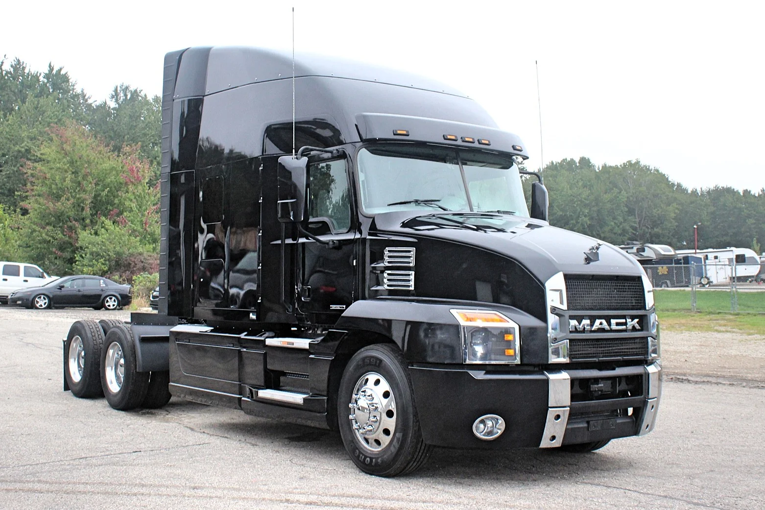2023 Mack Anthem – black sleeper semi truck front three-quarter view