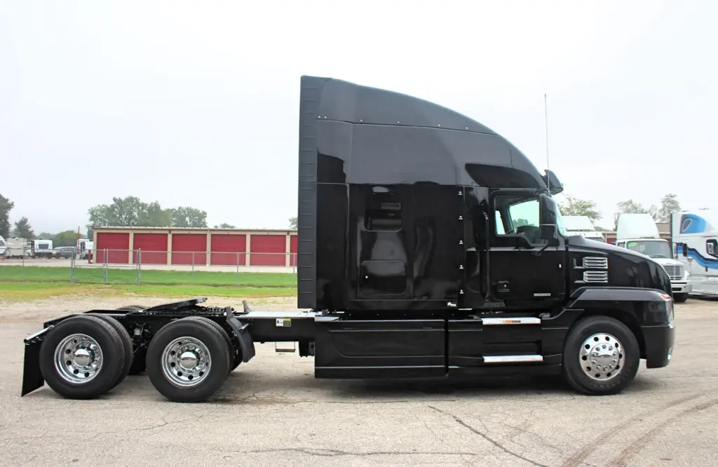 2023 Mack Anthem – black sleeper semi truck passenger side profile