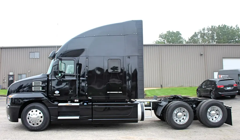 2023 Mack Anthem – black sleeper semi truck driver side profile