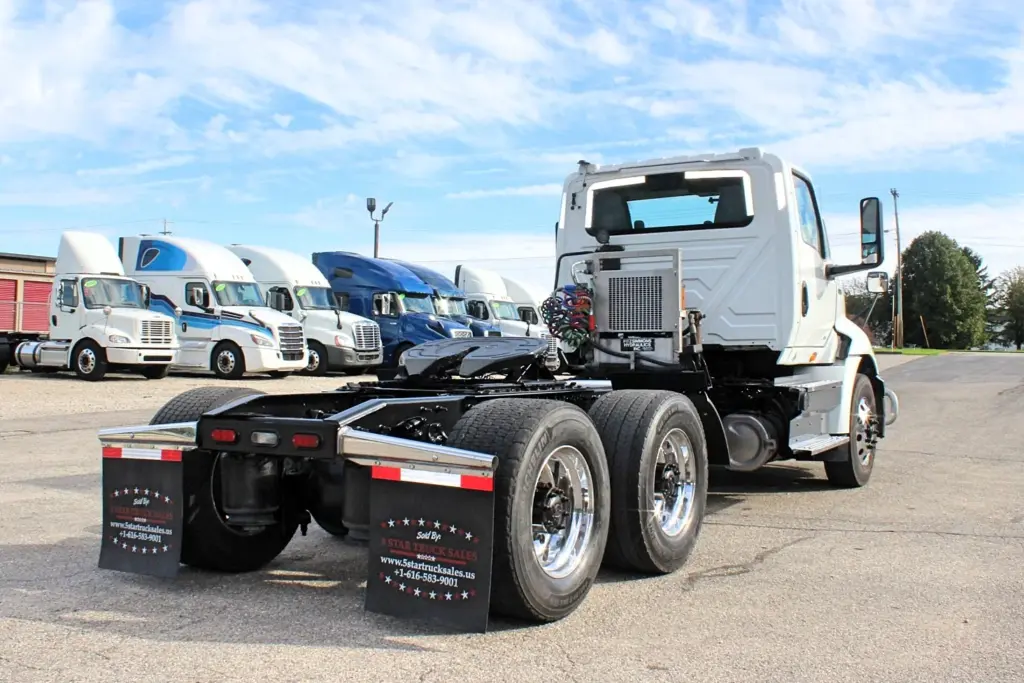 2020 International RH613 day cab truck rear three-quarter view with fifth wheel