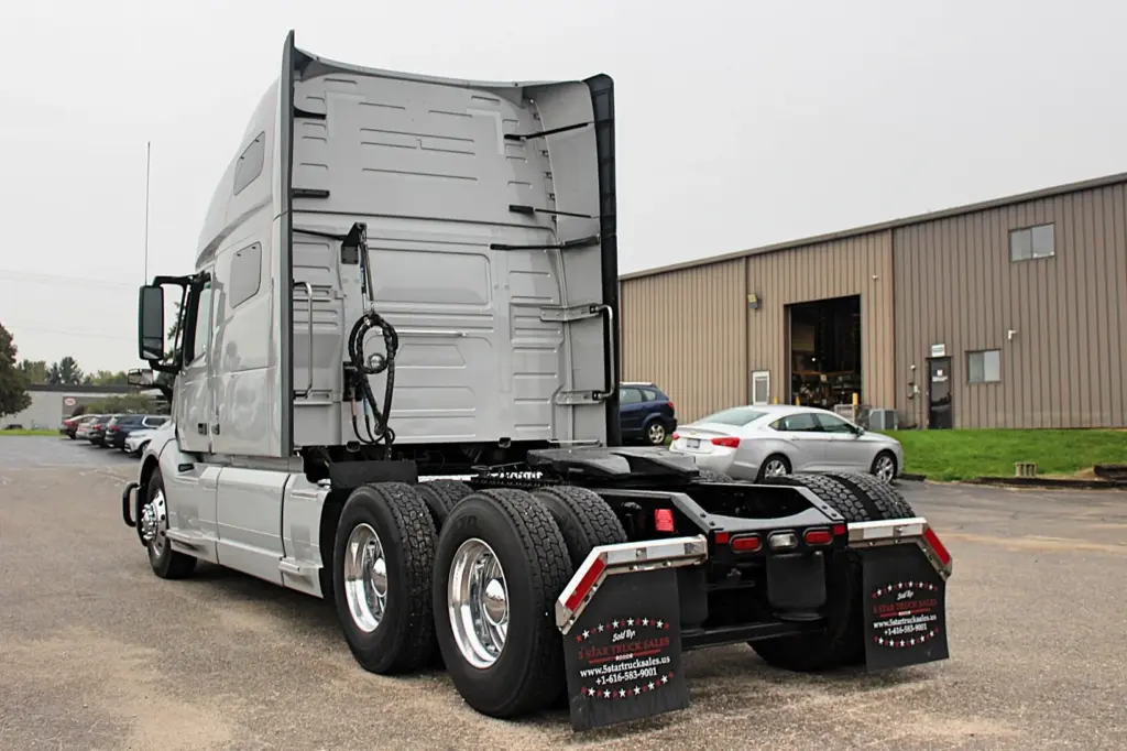 2022 Volvo VNL 760 – rear driver-side view of silver sleeper truck