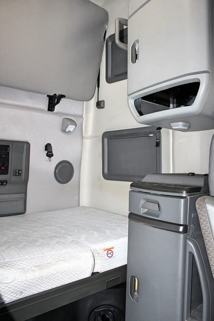 2022 Volvo VNL 760 – lower sleeper bunk with mattress and storage cabinets
