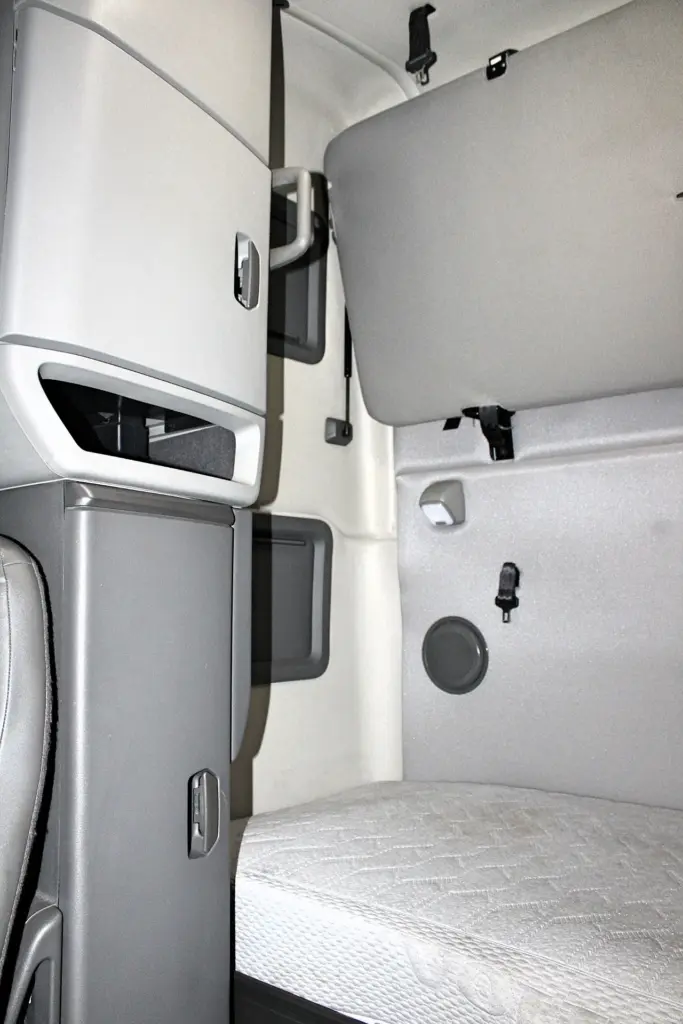 2022 Volvo VNL 760 – sleeper interior with upper bunk and storage cabinet