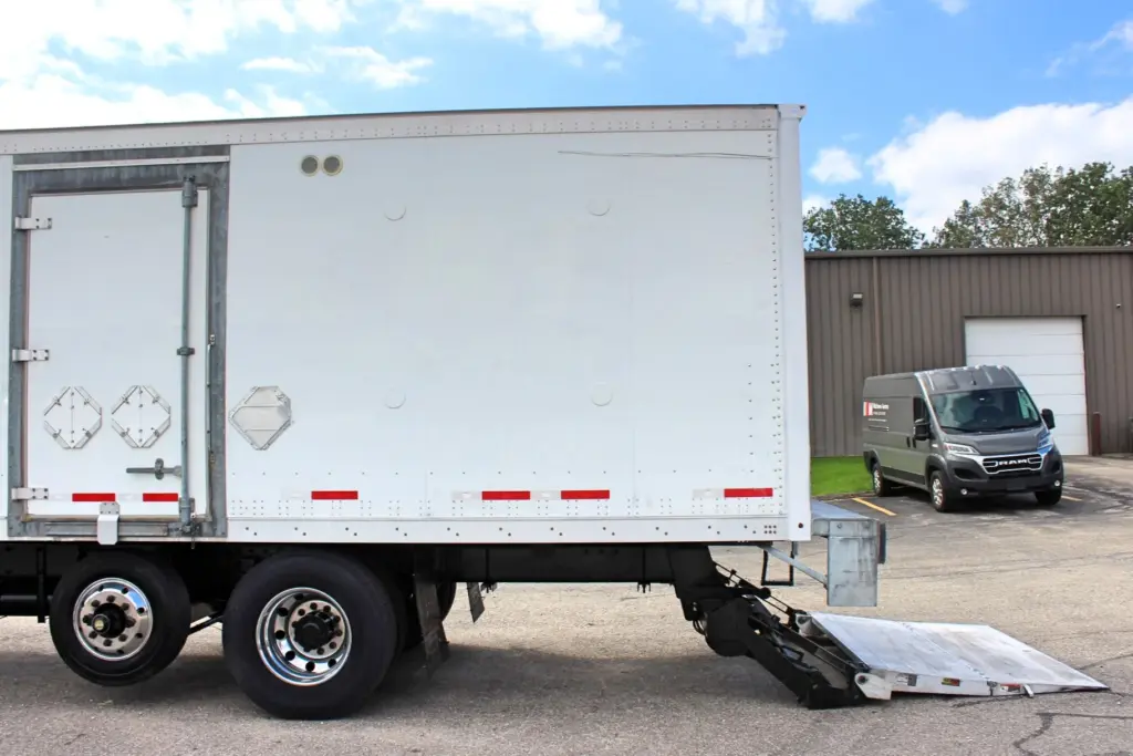 2018 Peterbilt 348 box truck – driver-side rear section with Maxon liftgate lowered
