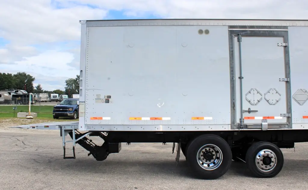 2018 Peterbilt 348 box truck – passenger-side rear section with Maxon liftgate folded and stowed