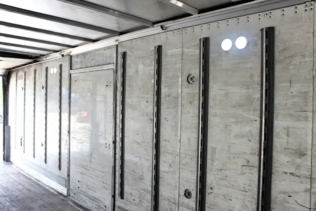 2018 Peterbilt 348 box truck – cargo box interior view toward the open side access door