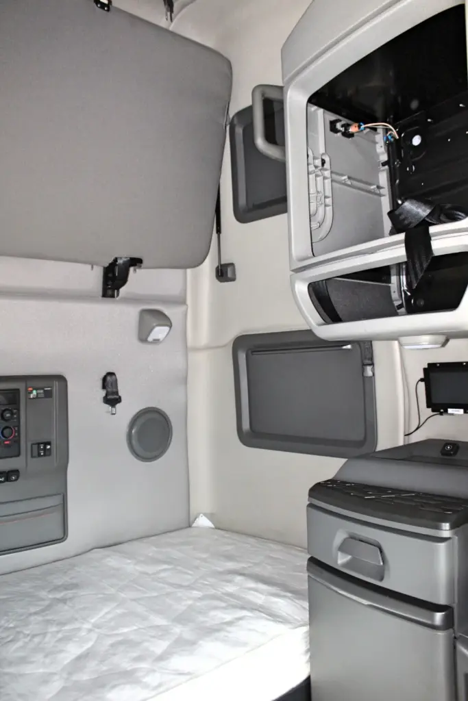 2024 Volvo VNL 760 sleeper - bunk area with overhead storage and interior compartments