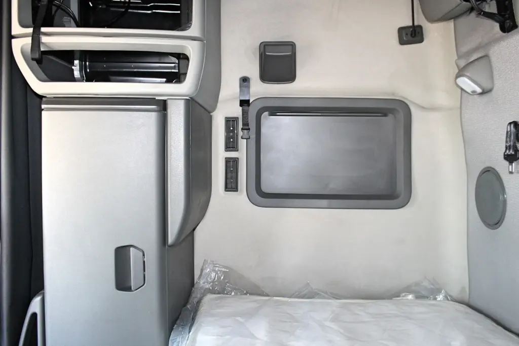2024 Volvo VNL 760 sleeper - lower bunk with storage cabinet and sleeper window