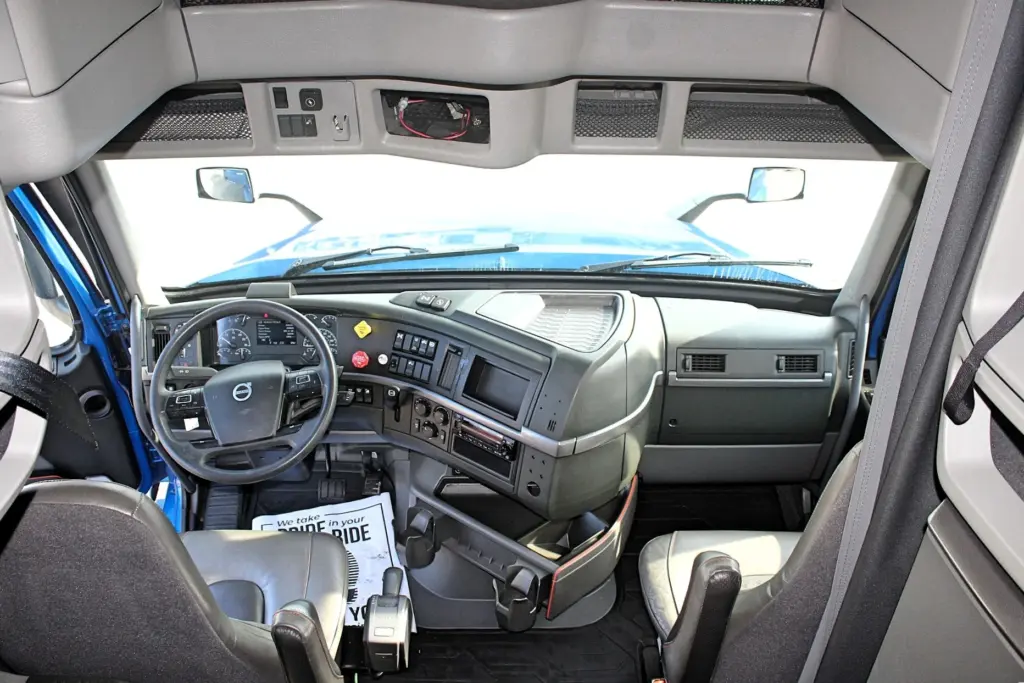 2024 Volvo VNL 760 - full cab interior view from sleeper with dashboard and seats