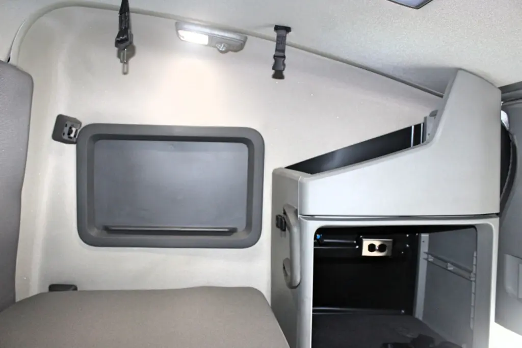 2024 Volvo VNL 760 sleeper - bunk and overhead storage compartment interior view