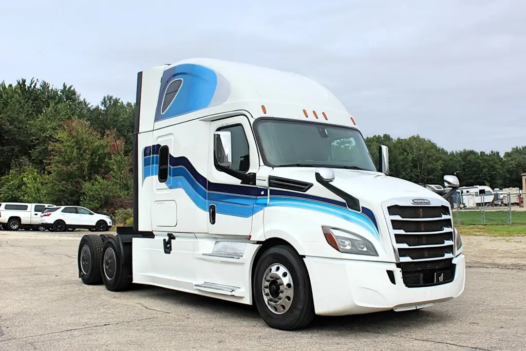 2019 Freightliner Cascadia 126 – white sleeper semi truck front passenger-side three-quarter exterior view