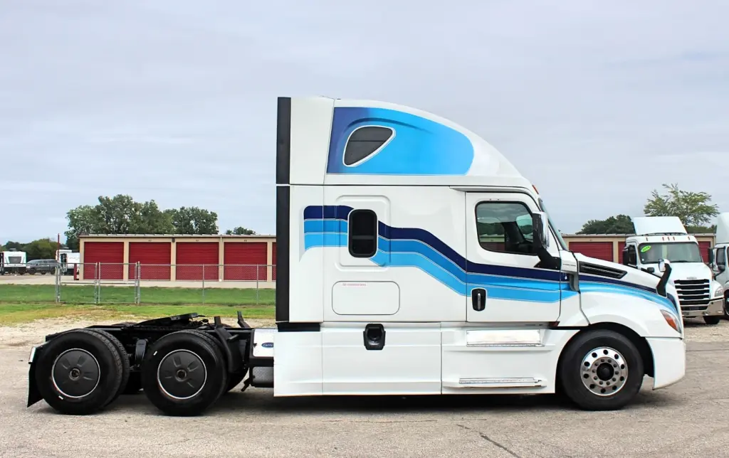 2019 Freightliner Cascadia 126 – white sleeper semi truck passenger-side profile exterior view