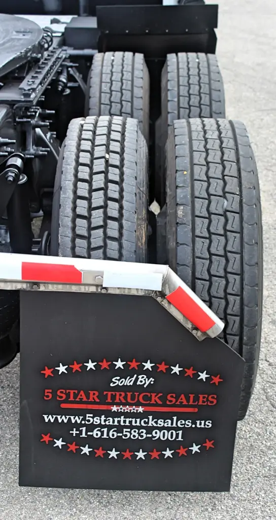 2019 Freightliner Cascadia 126 – rear dual tires and mudflap close-up