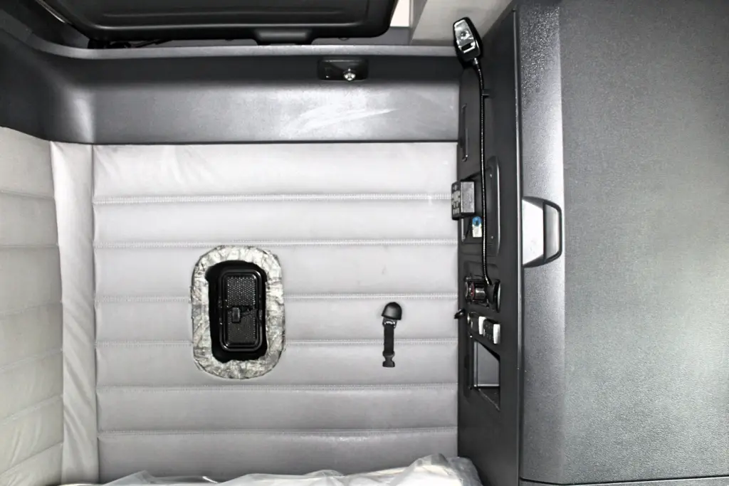 2019 Freightliner Cascadia 126 – sleeper interior with side window, lower bunk and storage cabinet