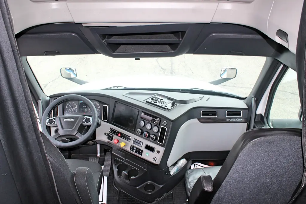 2019 Freightliner Cascadia 126 – full cab interior view showing dashboard, steering wheel and seats