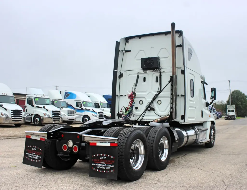 2019 Freightliner Cascadia 125 – Rear three-quarter exterior view of white sleeper semi truck