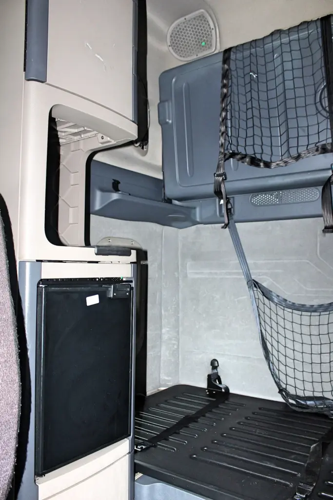 2019 Freightliner Cascadia 125 – Sleeper interior with bunk, upper storage, and refrigerator