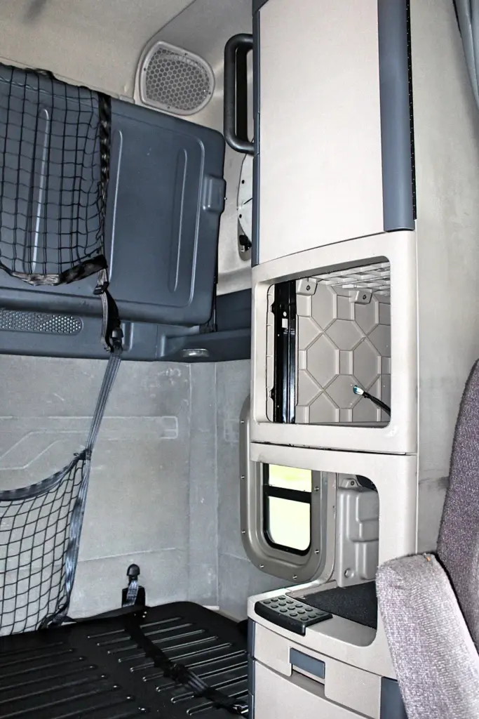 2019 Freightliner Cascadia 125 – Sleeper cab interior with storage cabinet and bunk area