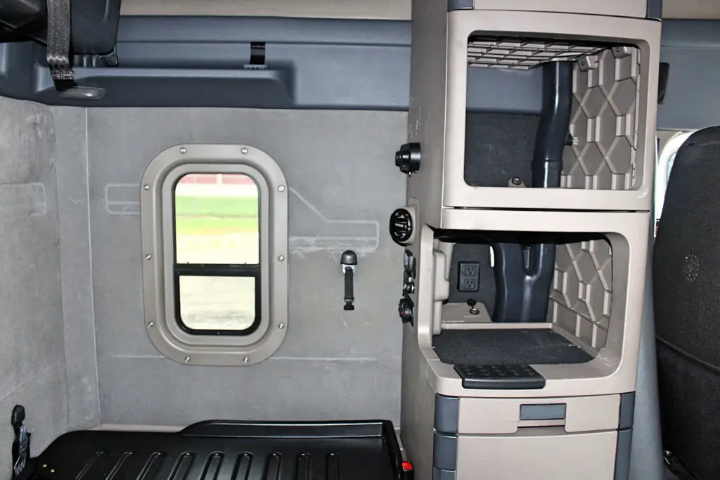 2019 Freightliner Cascadia 125 – Sleeper interior with side window, cabinet storage, and bunk platform