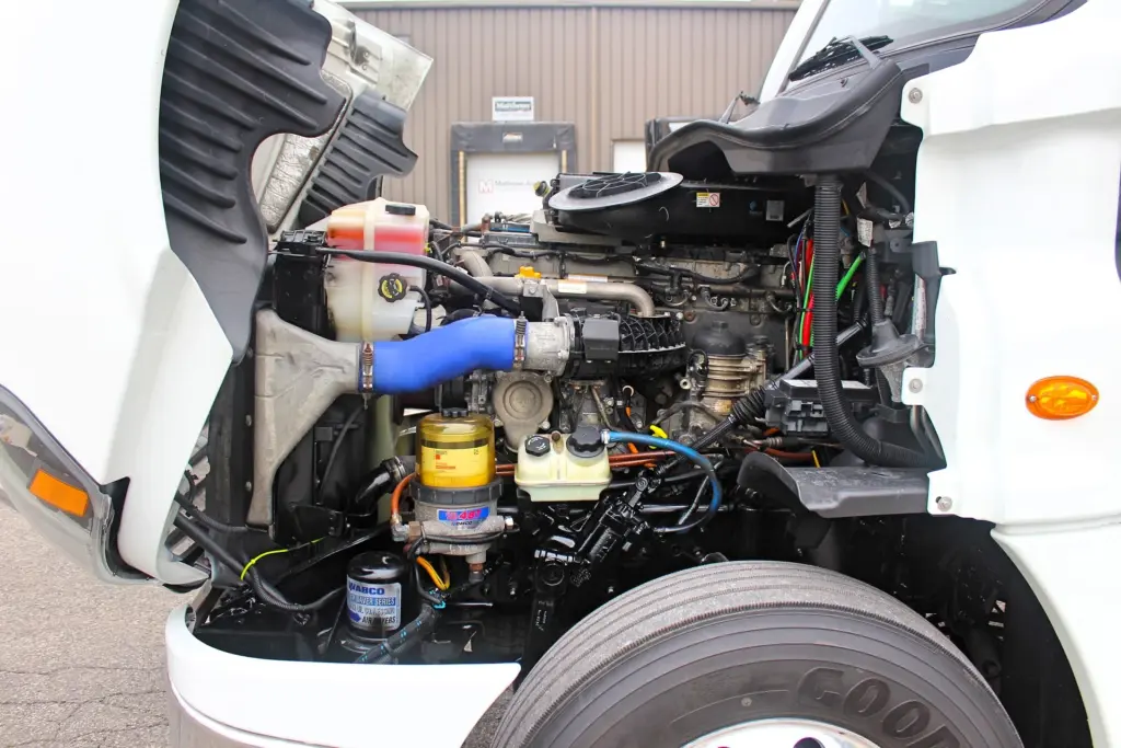 2019 Freightliner Cascadia 125 – Passenger-side engine bay view with hood open