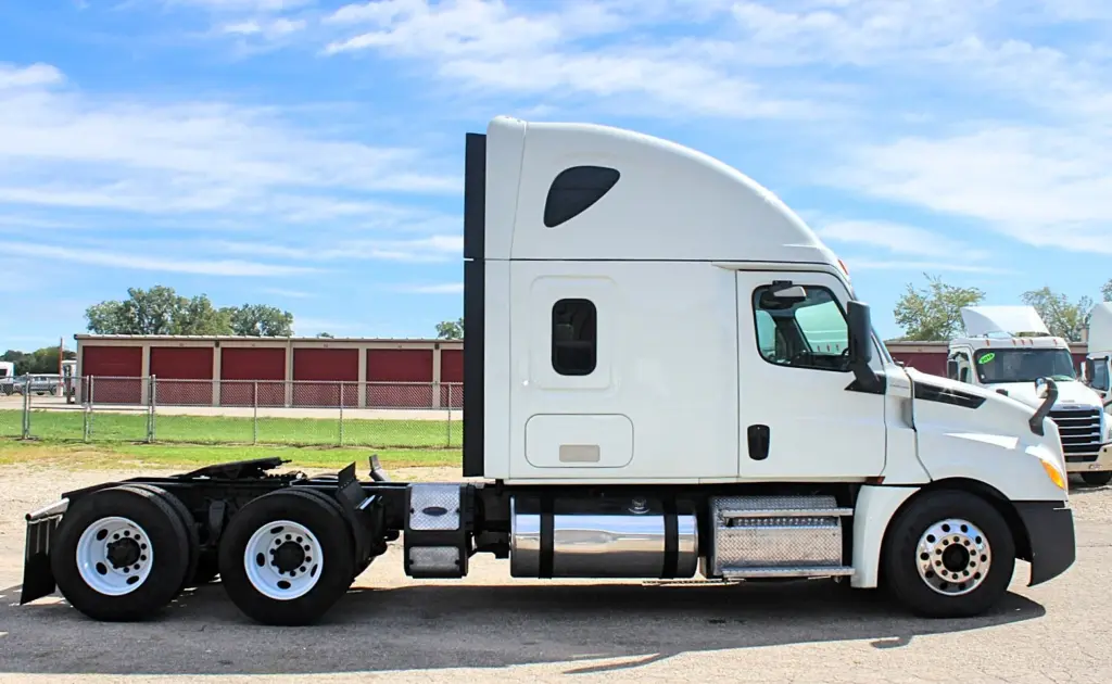 2020 Freightliner Cascadia 125 – white sleeper semi truck passenger-side profile exterior view
