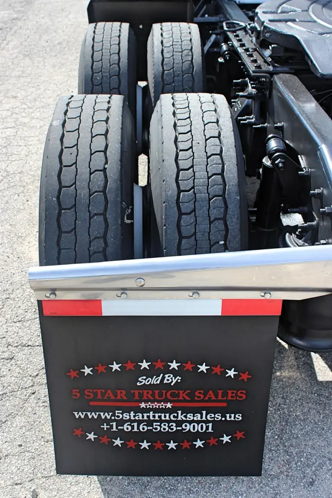 2020 Freightliner Cascadia 125 – driver-side rear dual tires and mudflap close-up