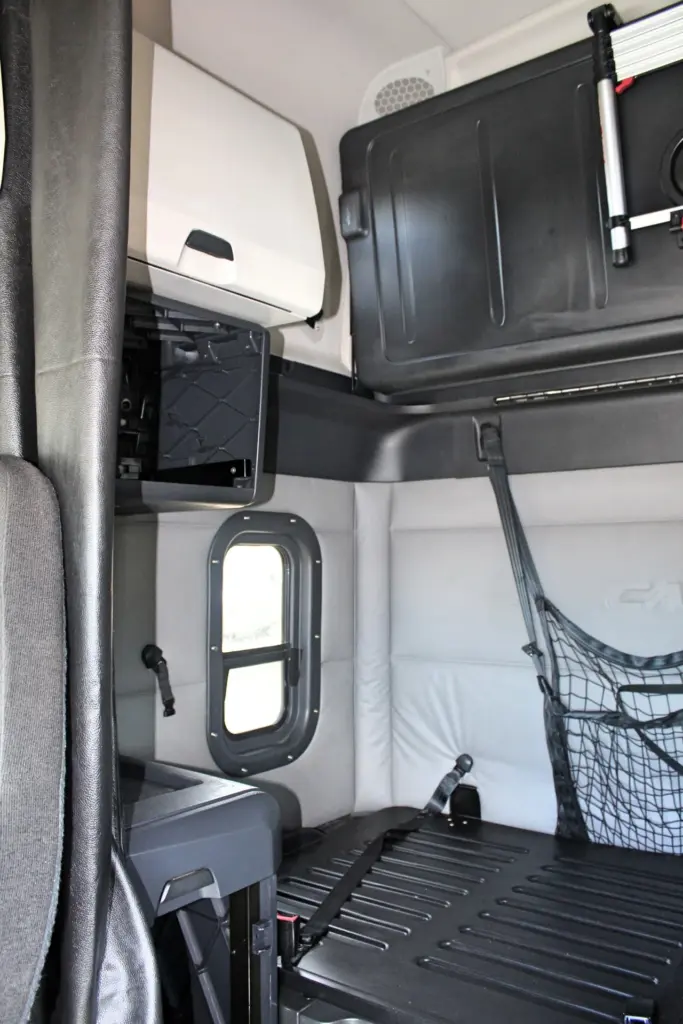 2020 Freightliner Cascadia 125 – sleeper interior with lower bunk, storage cabinet and side window