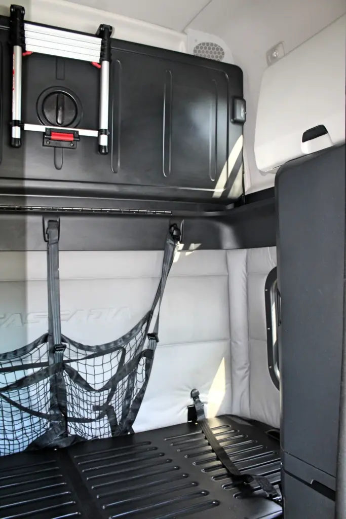 2020 Freightliner Cascadia 125 – sleeper bunk area with storage compartments and cargo net