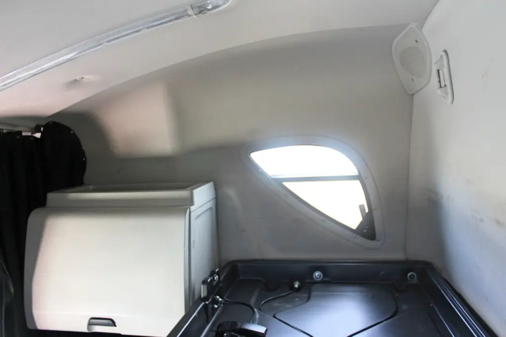 2020 Freightliner Cascadia 125 – sleeper upper interior with side window and storage cabinet
