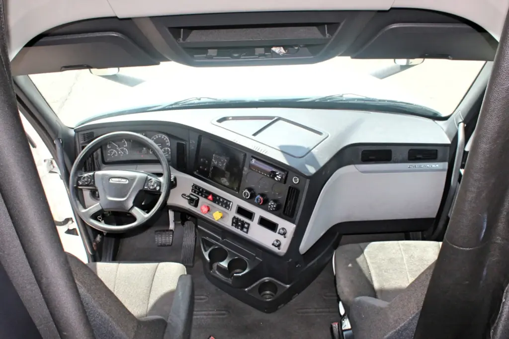 2020 Freightliner Cascadia 125 – wide cab interior view of dashboard, steering wheel and seats