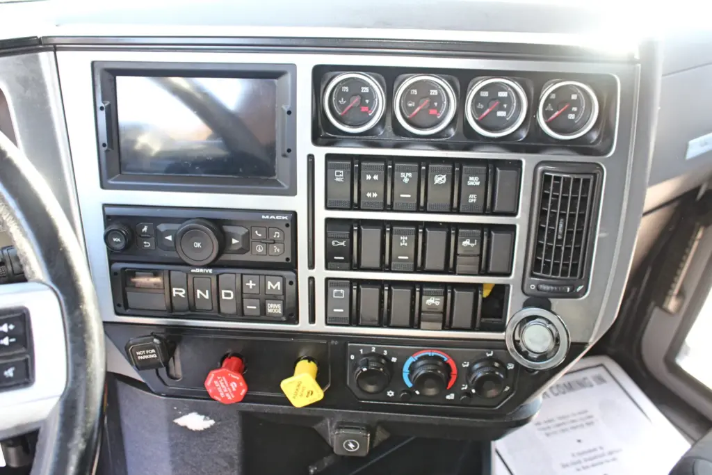 2023 Mack Anthem — center dash panel with four round gauges, mDRIVE R-N-D shift buttons, Mack radio, rocker switches and climate knobs