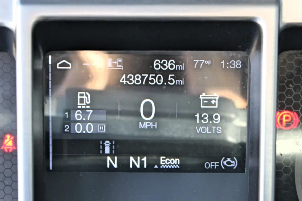 2023 Mack Anthem — close-up of digital dash display showing 438750.5 odometer miles, 0 mph, 13.9 volts, neutral and Econ mode