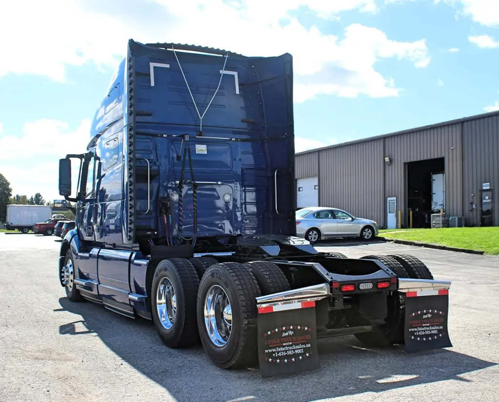 2020 Volvo VNL 760 – rear driver side view of blue sleeper tractor