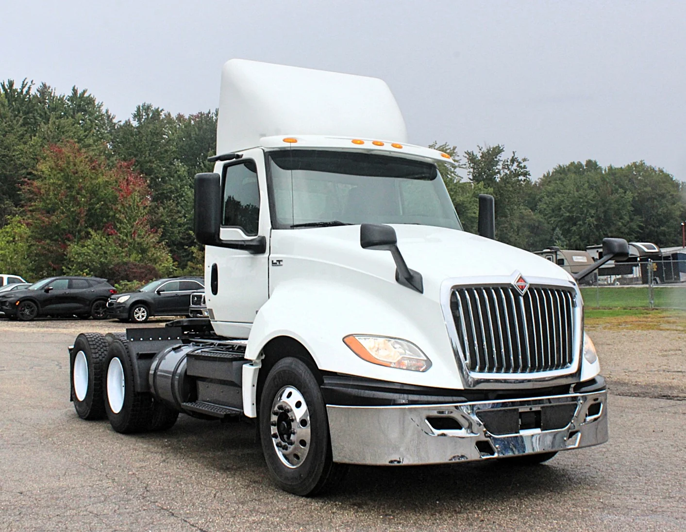2019 International LT625 – white day cab semi truck front three-quarter exterior view.