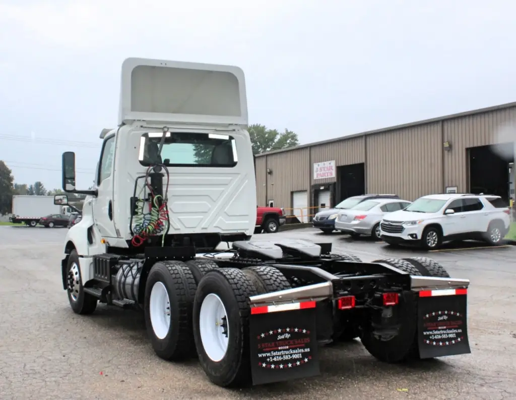 2019 International LT625 – rear three-quarter view of day cab tractor with fifth wheel.