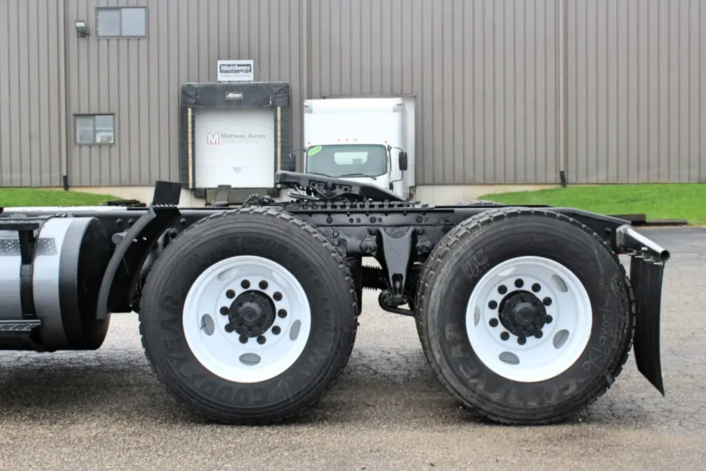 2019 International LT625 – close-up of tandem rear axles and white steel wheels.