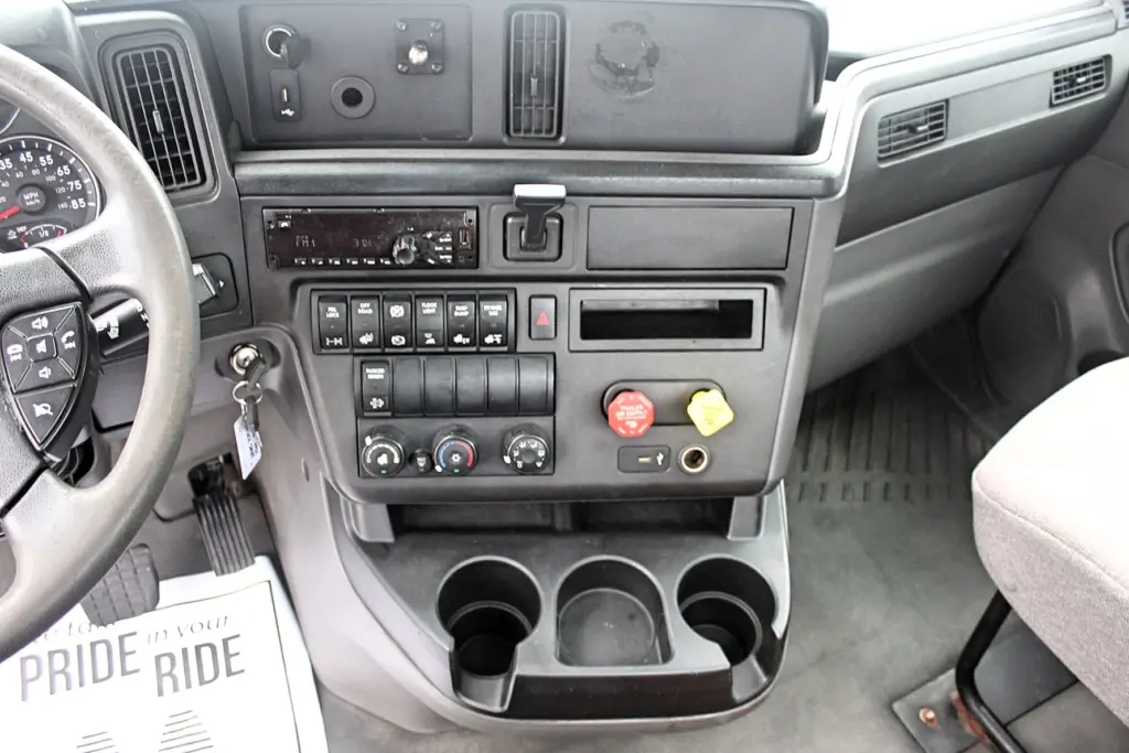 2019 International LT625 – dashboard controls, radio, climate controls and air brake knobs.