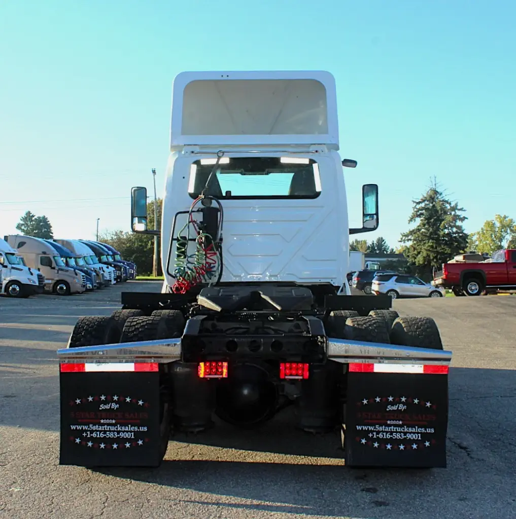 2019 International LT625 – rear view of day cab tractor, fifth wheel and tandem drive axles.