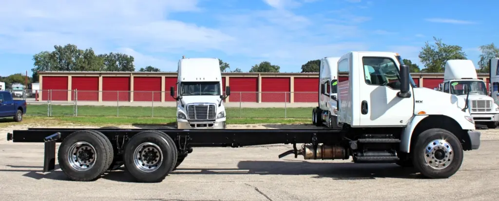 2020 International MV607 – passenger side view of tandem axle cab and chassis truck