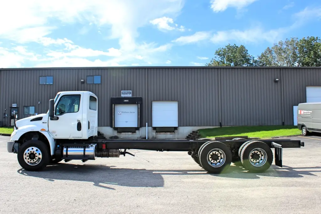 2020 International MV607 – full driver side view of long wheelbase cab and chassis