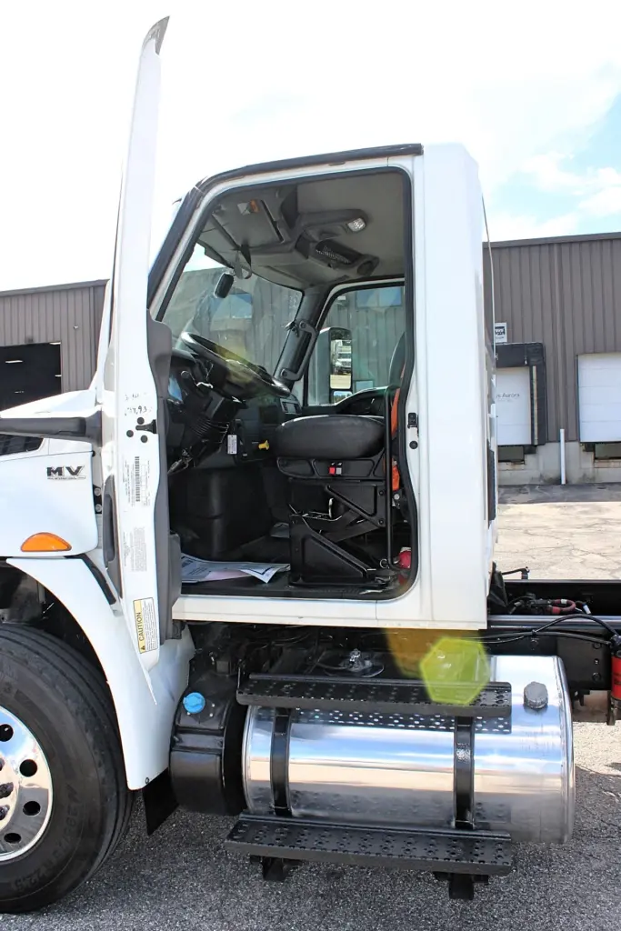 2020 International MV607 – driver door open showing cab entry and interior