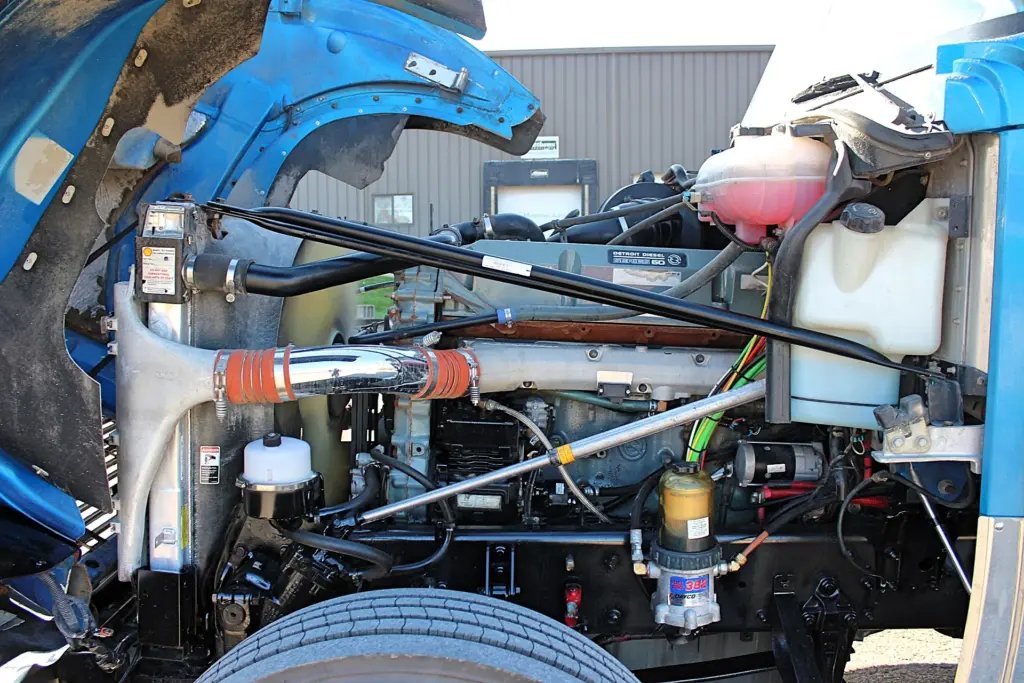 2016 Freightliner Coronado 132 — side angle into the engine bay with chrome intake pipe, coolant tank and Series 60 engine