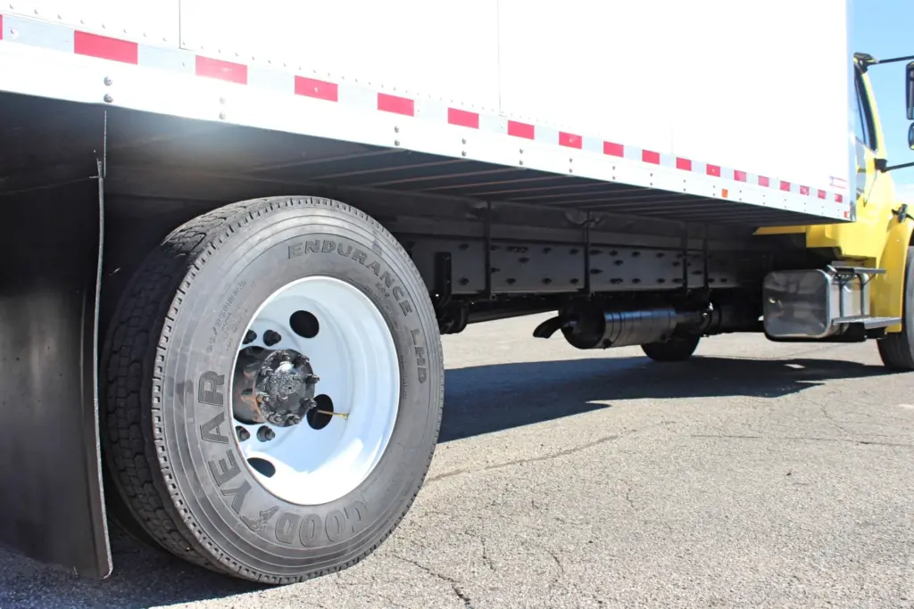 2016 Freightliner M2-106 Box Truck – close-up of rear drive tires, axle and underside of Morgan box body.