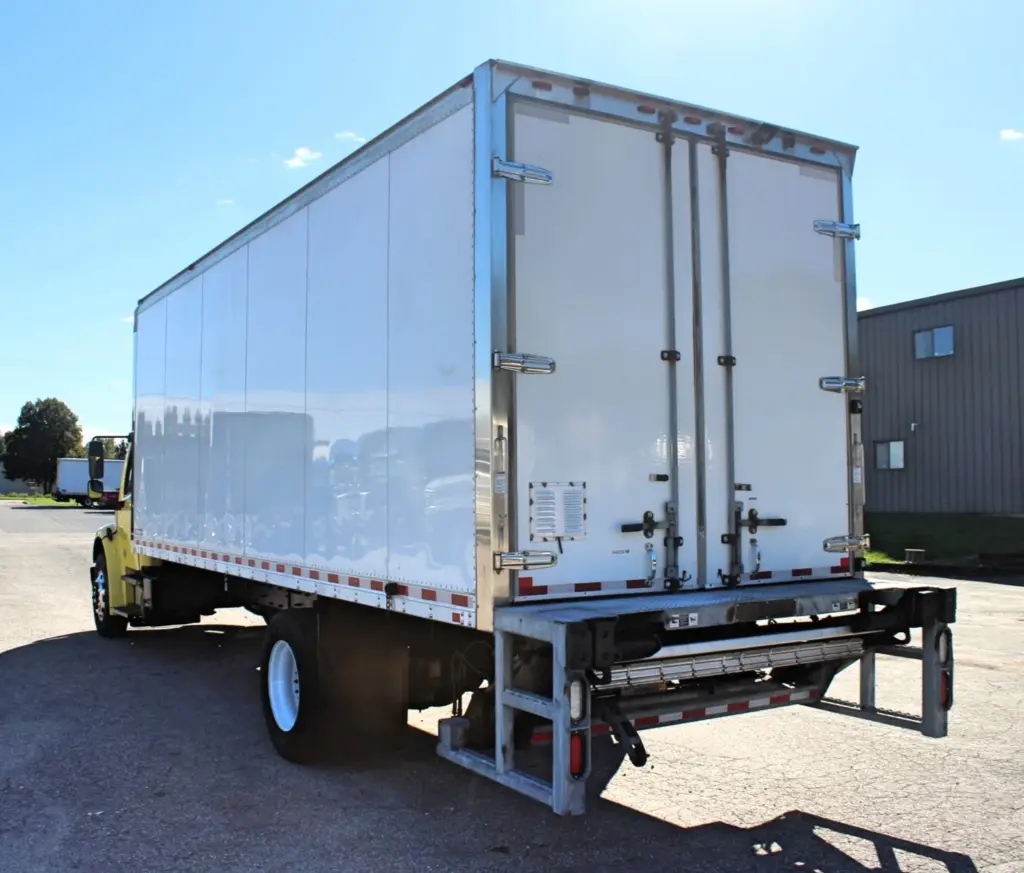 2016 Freightliner M2-106 Box Truck – rear corner view showing commercial box body, rear doors and liftgate.
