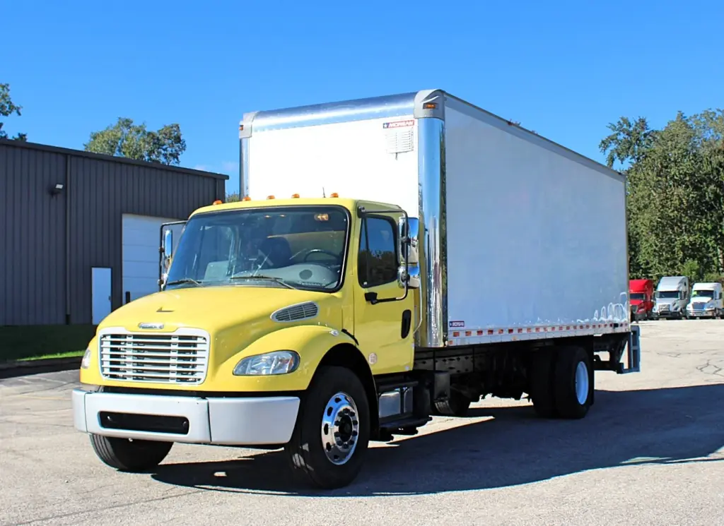 2016 Freightliner M2-106 Box Truck – front three-quarter exterior view of yellow medium-duty commercial truck.