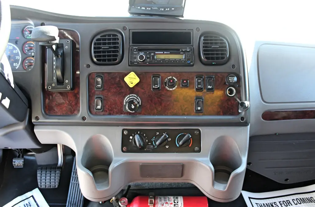 2016 Freightliner M2-106 Box Truck – center dashboard with automatic transmission selector, climate controls and switches.