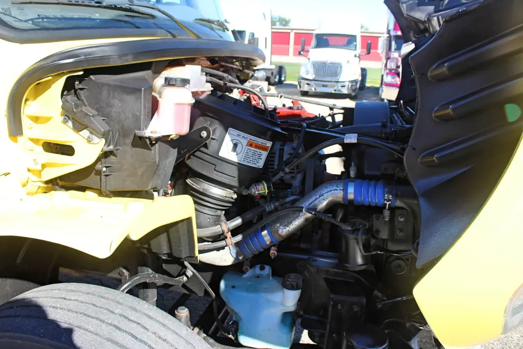 2016 Freightliner M2-106 Box Truck – under-hood view showing engine air intake, coolant reservoir, piping and engine compartment components.
